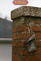 Rain falling on a home's chimney and roof in Lexington, KY