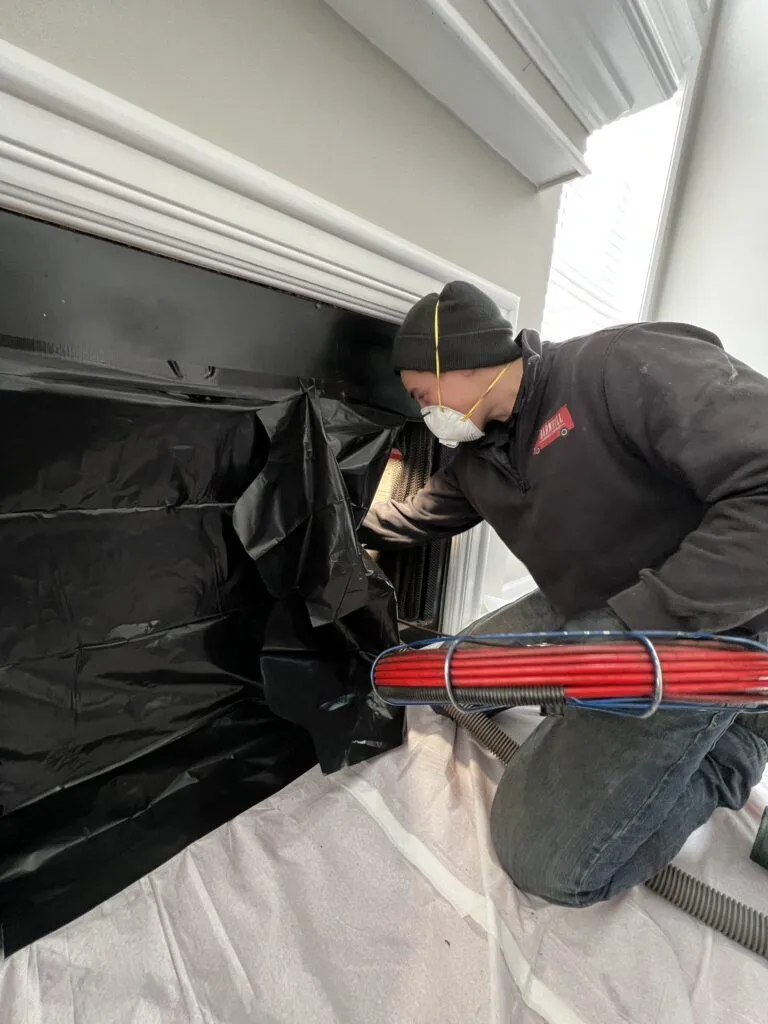 Barnhill technician performing a chimney inspection